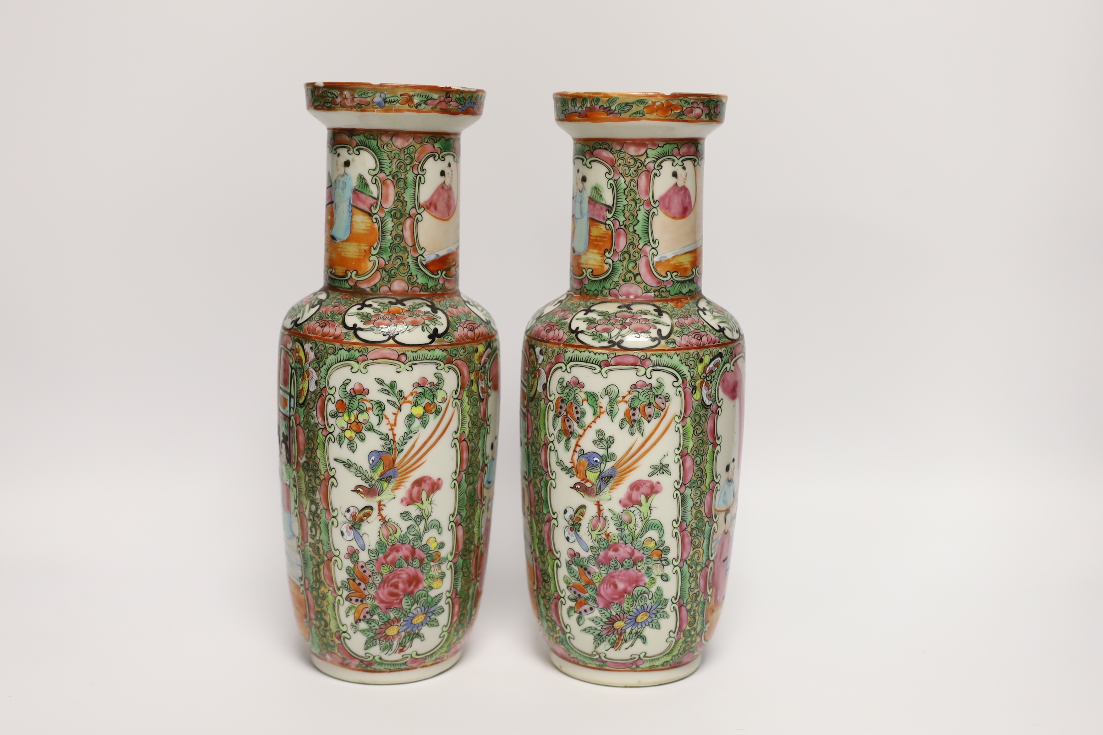 A pair of early 20th century Chinese famille rose vases, 26cm high